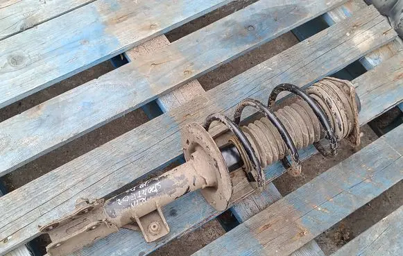 KIA Sportage Front shock absorber with coil spring 546603U010 546613U0010