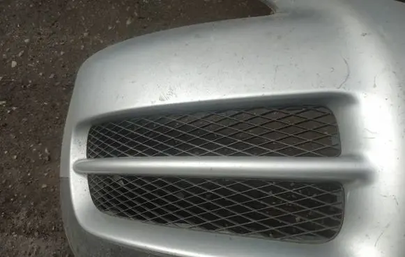 Volkswagen Touareg I Front bumper lower grill 