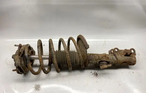 Front shock absorber with coil spring