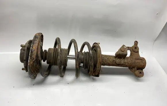 Nissan Primera Front shock absorber with coil spring