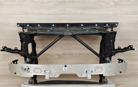 Radiator support slam panel