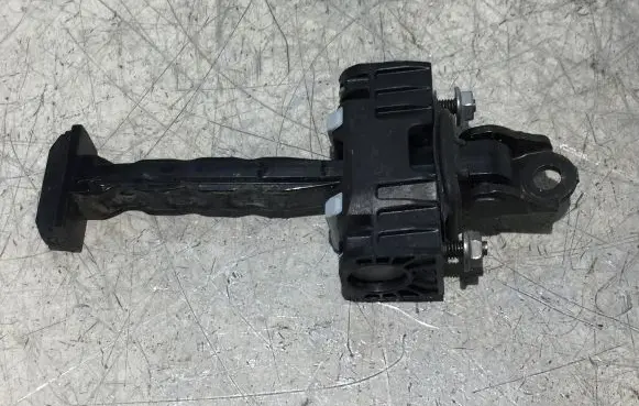 Front door check strap stopper