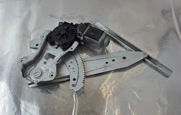 Rear door window regulator with motor