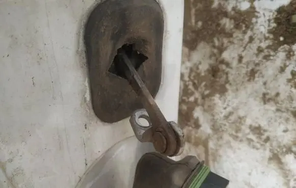 Front door check strap stopper