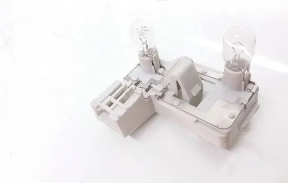 Tail light bulb cover holder