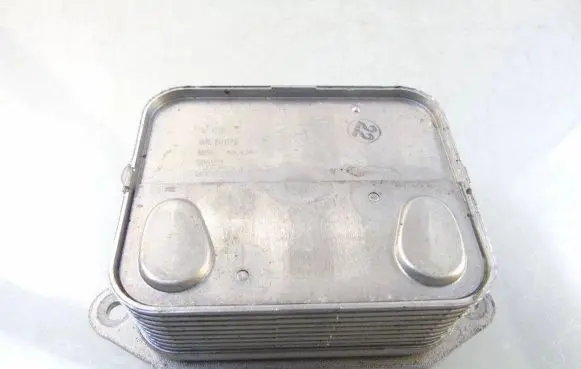 Audi A1 Oil filter mounting bracket 04E117021L