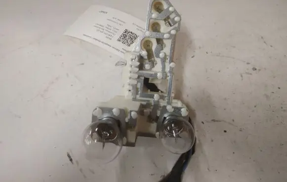 Tail light bulb cover holder