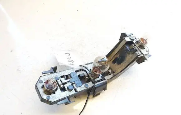 Tail light bulb cover holder