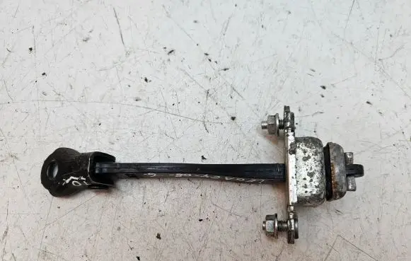 Subaru Legacy Rear door check strap stopper
