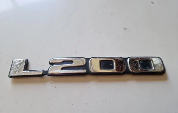 Mitsubishi L200 Front door emblem/model letters 