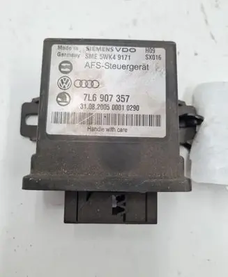 Volkswagen Touareg I Light module LCM 7L6907357