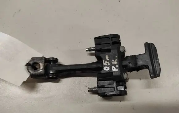 Front door check strap stopper