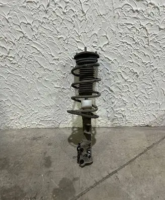 Front shock absorber with coil spring