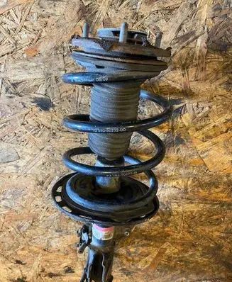 Front shock absorber with coil spring
