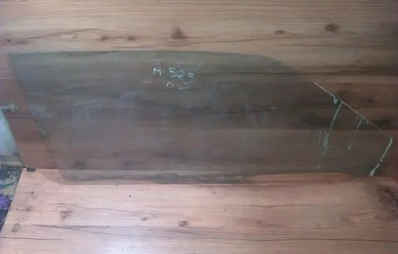 Mazda 323 Front door window glass four-door