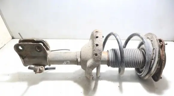 Subaru Legacy Front shock absorber with coil spring