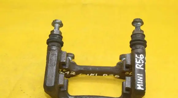 Mini One - Cooper Coupe R56 Brake caliper pad carrier rear 