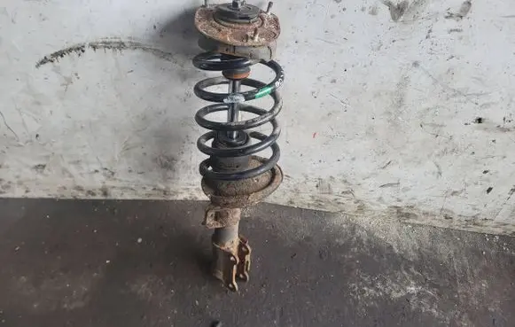 Volvo XC90 Front shock absorber with coil spring