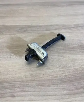 Front door check strap stopper