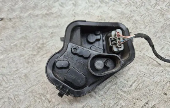 Tail light bulb cover holder