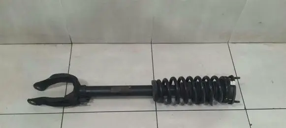 Mercedes-Benz ML W166 Front shock absorber with coil spring A1663231000