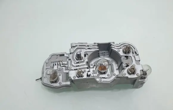 Tail light bulb cover holder