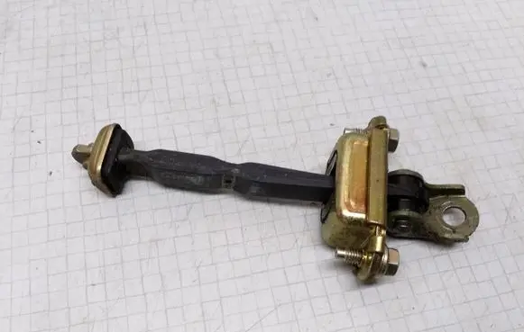 Nissan Primera Front door check strap stopper