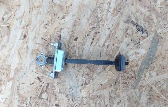 Subaru Legacy Front door check strap stopper