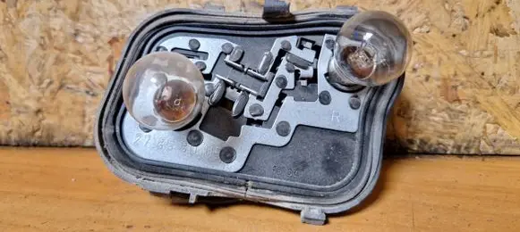 Mitsubishi Colt Tail light bulb cover holder 27852201