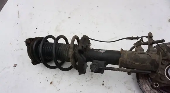 Renault Megane III Front shock absorber with coil spring MCPERSON