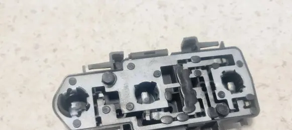 Tail light bulb cover holder