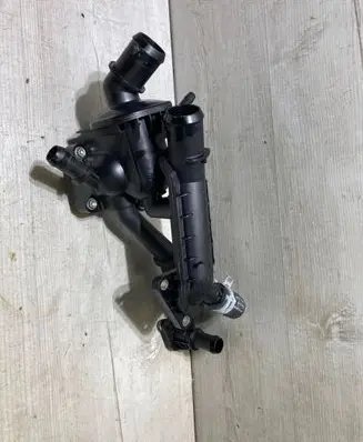 Thermostat/thermostat housing