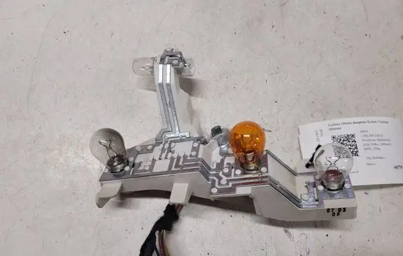 Tail light bulb cover holder