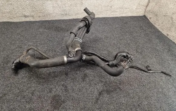 Volkswagen PASSAT B7 Engine coolant pipe/hose 1K0121087AF 03L121131AA