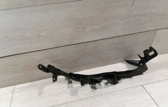 Subaru Impreza V Headlight/headlamp mounting bracket 57707FL010