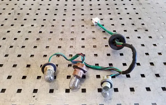 Nissan Juke I F15 Tail light bulb cover holder
