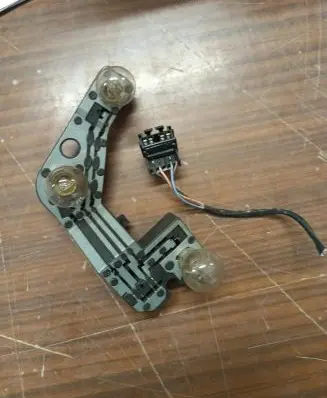 Tail light bulb cover holder