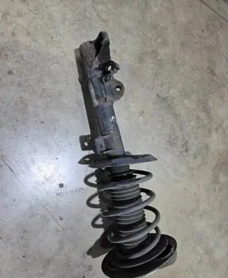 Front shock absorber with coil spring