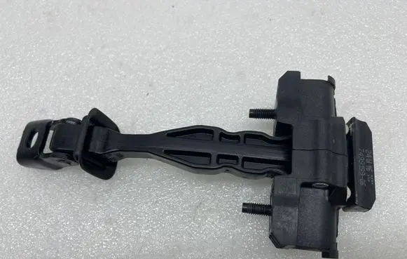 Front door check strap stopper