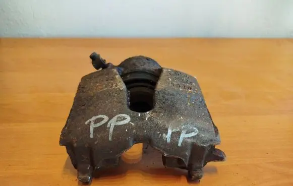 Opel Astra G Front brake caliper 