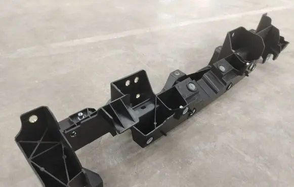 Top upper radiator support slam panel