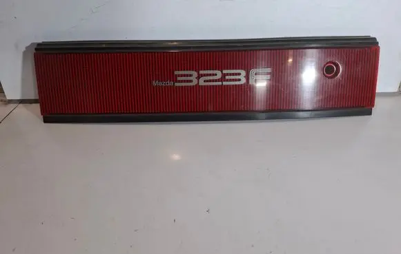 Mazda 323 F Rear light center trim bar blend 0674434