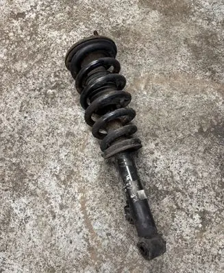 Mitsubishi L200 Front shock absorber with coil spring MR992321