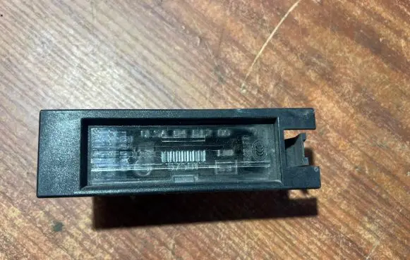 Opel Corsa D Number plate light 0461200 13139990