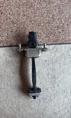 Subaru Outback Rear door check strap stopper 63302FC002