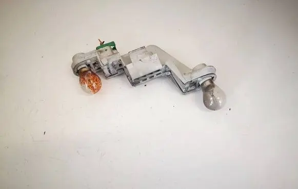 Tail light bulb cover holder