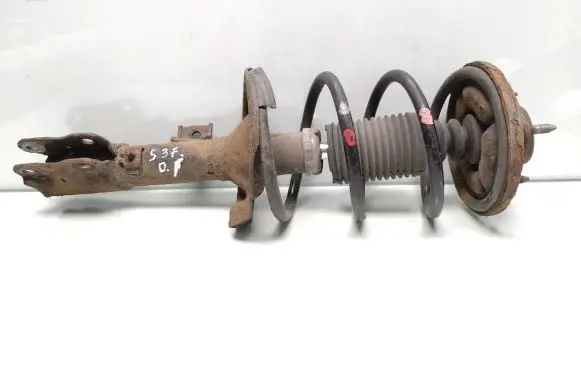 Mitsubishi Lancer VIII Front shock absorber with coil spring