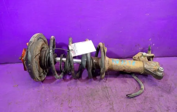 Nissan Primera Front shock absorber with coil spring