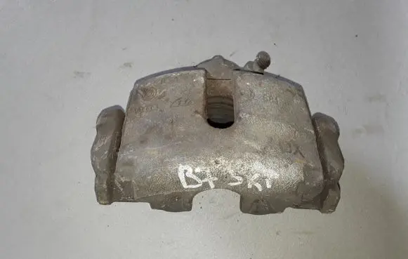 Volkswagen PASSAT B7 Front brake caliper 1K0615123E