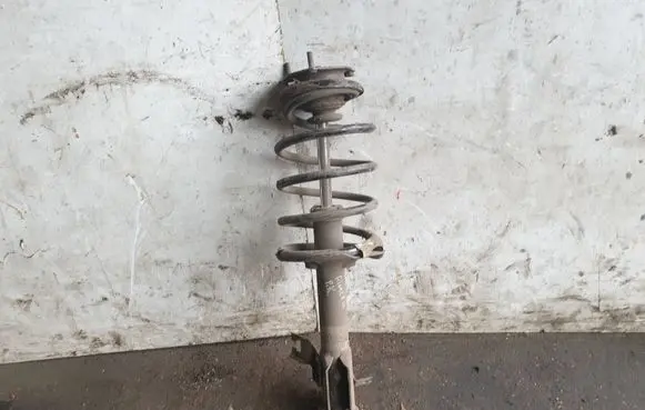 Nissan Almera N16 Front shock absorber with coil spring